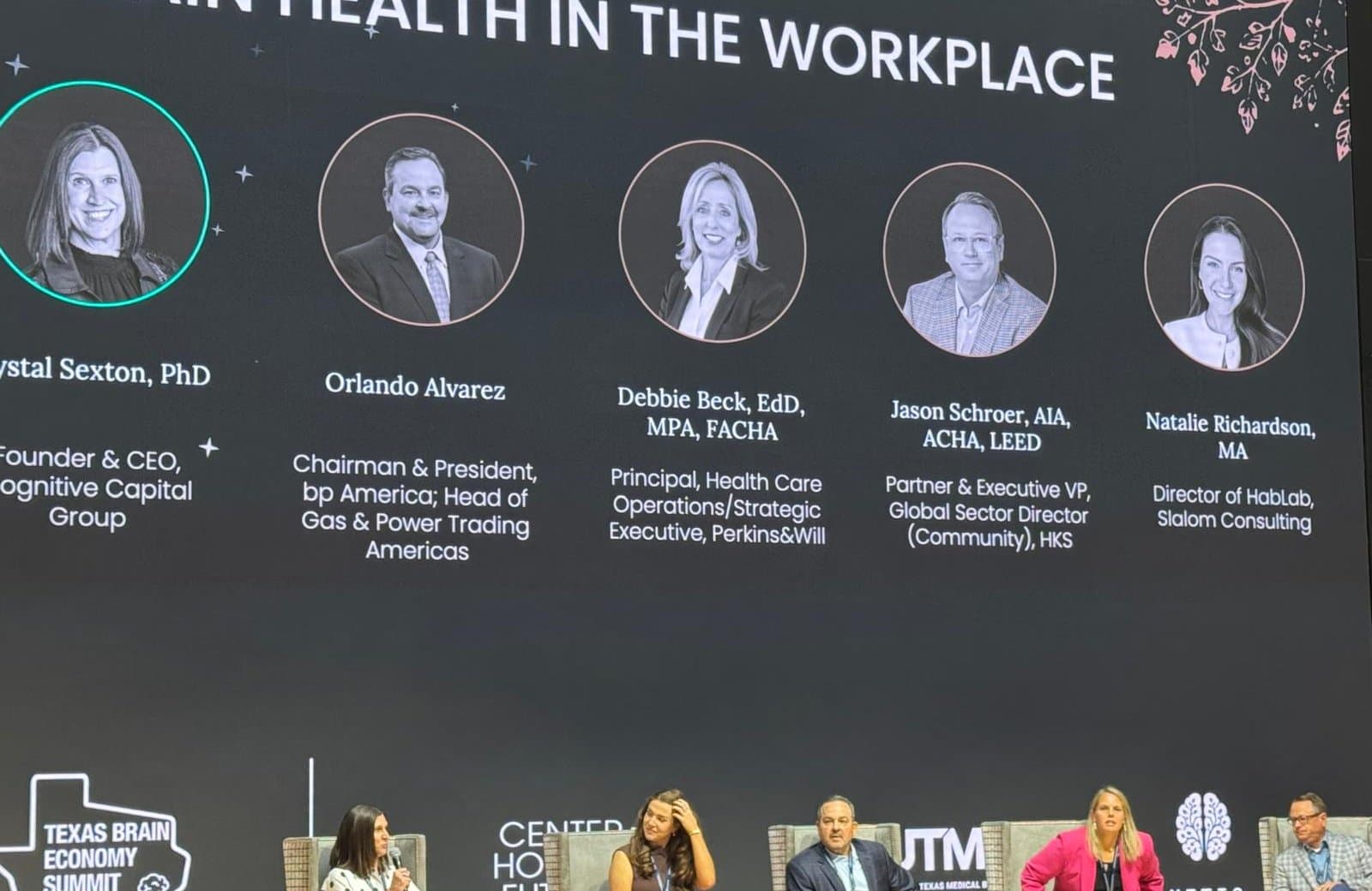 The Brain Health in the Workplace panel slide, with Krystal Sexton's headshot, above the stage at the Texas Brain Economy Summit, Houston, June 2026